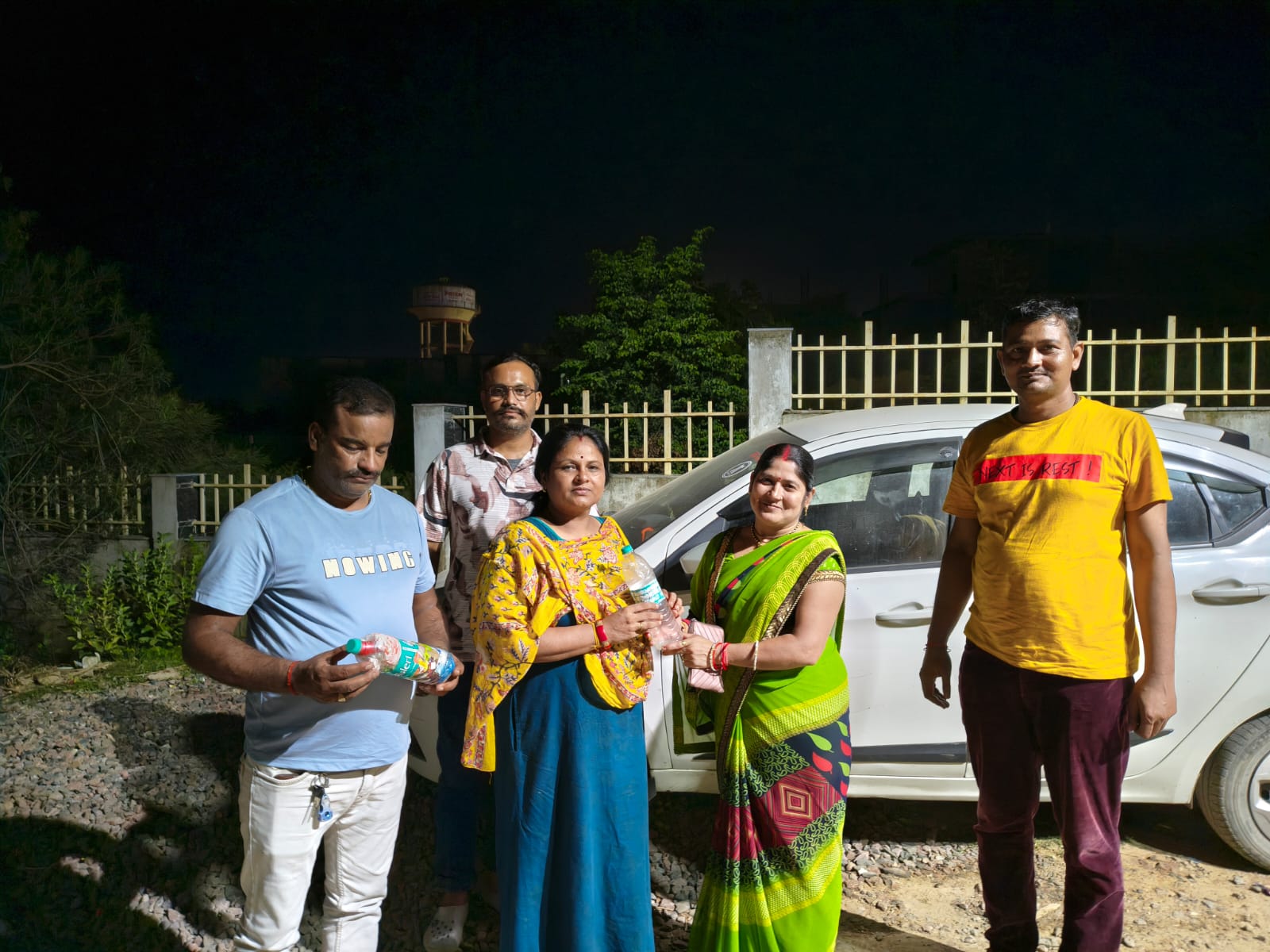 Local residents and public representatives engage with the bottle-based intervention.